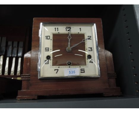 A mid century deco style mantle clock
