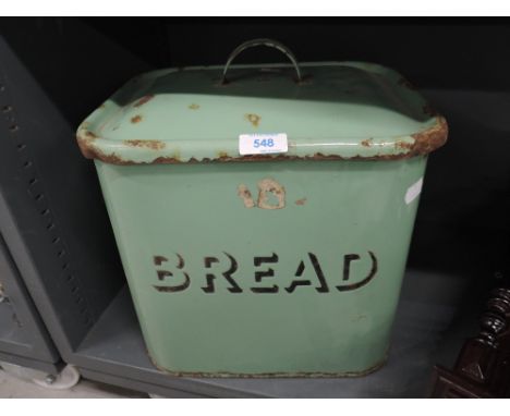 A vintage enamel bread bin
