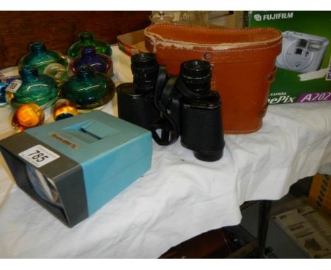A cased set of binoculars, a cased Fuji film camera and a Boots slide viewer.