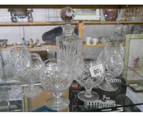 A crystal decanter and six brandy glasses. COLLECT ONLY.