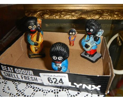 Three vintage Robertsons Jam golly band figures and a pin badge.These items are listed on the basis they are illustrative of 