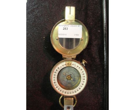 A WWII Mk III brass compass by T G Co Ltd., London dated 1943