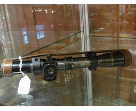 A WWII Enfield No 4 (T) Sniper scope, TEL STG No 32 MK3  O.S.2039A CT&S No 21260, War Dept: stamped with leather lens covers 