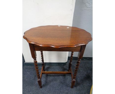 An Edwardian oak shaped barley twist leg occasional table together with a baize topped card table 