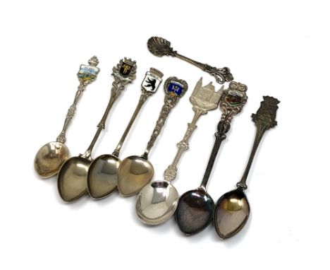 Eight silver spoons, some enamel examples.