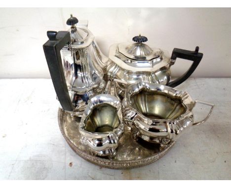 A four piece plated tea service on circular tray  