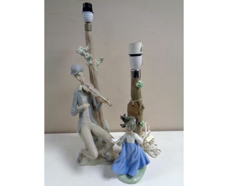 A Nao figural table lamp, girl with bird in hand, together with a further Spanish table lamp, man with violin 