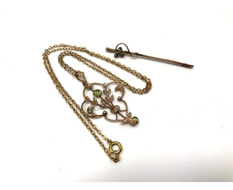 An Edwardian peridot and seed pearl pendant on chain (a/f) together with a 9ct gold bar brooch.  CONDITION REPORT: 6.8g gross