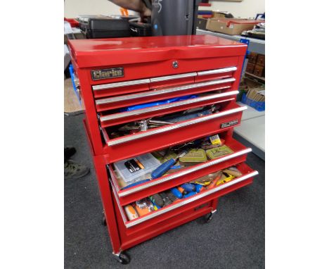 A Clarke metal tool chest on cabinet containing a large quantity of assorted hand tools, hardware, Black and Decker jigsaw  
