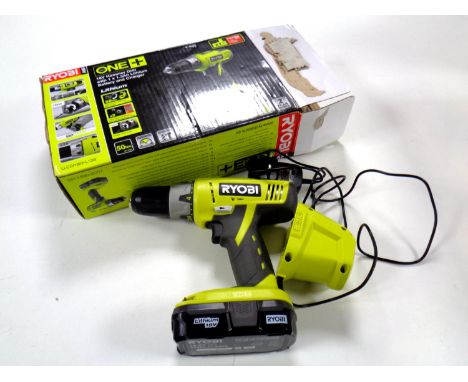 A boxed Ryobi 18 volt hammer drill  