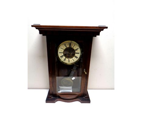An Edwardian cased eight day wall clock with brass dial 