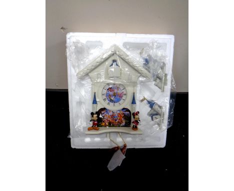 A Bradford Exchange Disney's Happiest of Times cuckoo clock with pendulum and weights 