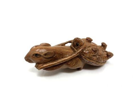 A carved hardwood Chinese netsuke - Rat pulling a turtle 
