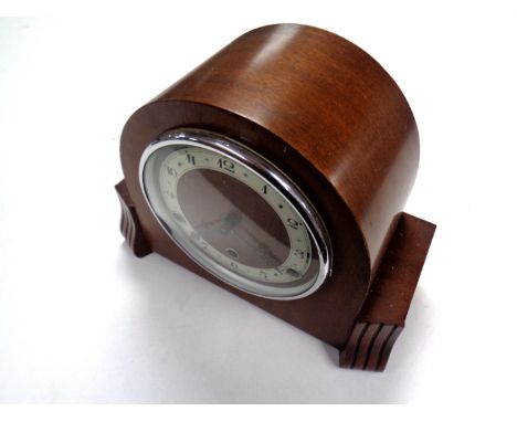An early 20th century mahogany cased eight day mantel clock with silvered dial 