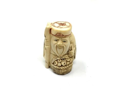 A carved bone Chinese netsuke - Village elder with food basket