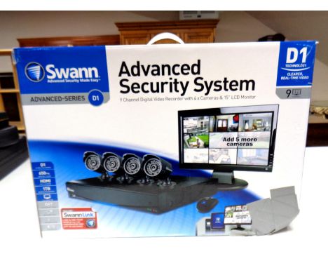 A Swann Advanced Security System, 9 channel digital video recorder with four cameras and 15'' LCD monitor, boxed  