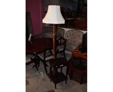 A modern standard lamp with cream shade and a modern telephone table.