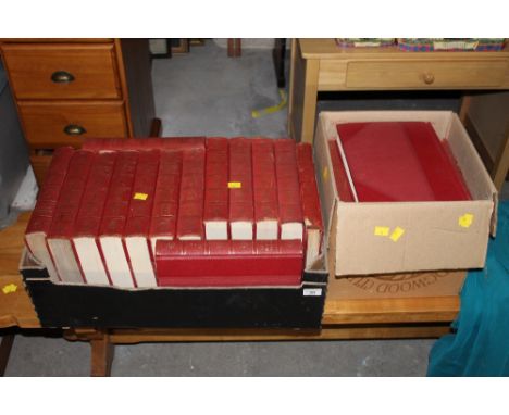 Two boxes of encyclopedia Britannica books.  