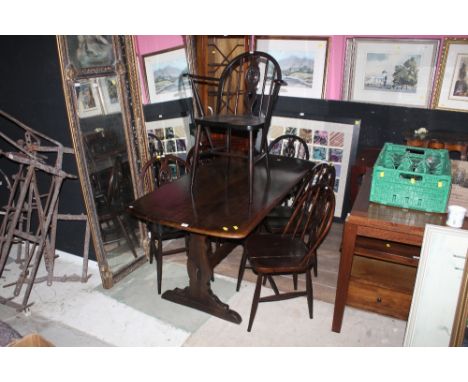 An Ercol style dining table with six matching chairs, table length 150 cm (A0211)