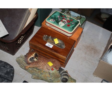 A teak wood jewellery box, the interior with label reading teak wood from HMS Nelson, three vintage tins, a Bossons figure or