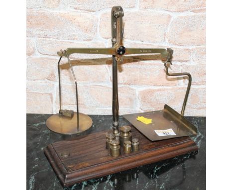A set of brass and oak GPO (Grave &amp; Co London) postal scales and weights 