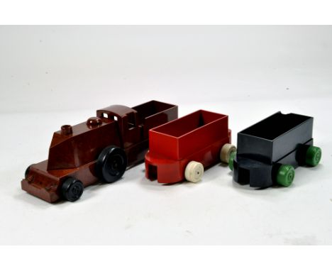 Hard to find Chad Valley Bakelite issue Railway Toys including Locomotive and Wagons. Generally VG to E. (3)