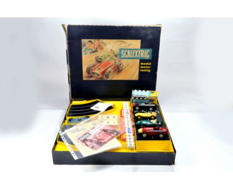An Early issue Scalextric No. 3 Racing Car Set comprising predominantly complete contents plus additional cars. Original Tin 