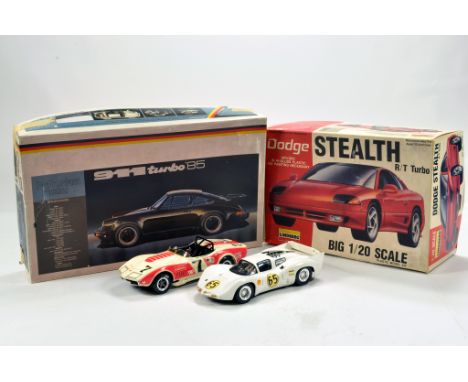 Duo of plastic model kits assembled plus interesting empty boxes. (4)