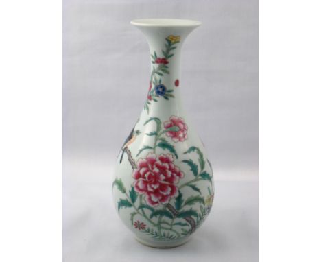 A Chinese ceramic baluster vase with birds and flowers in overglaze enamels. Double circle mark to underside. Ht 20cm.