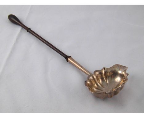 An 18th. century silver punch ladle with turned hardwood handle, by Joseph Ash, London, 1754.