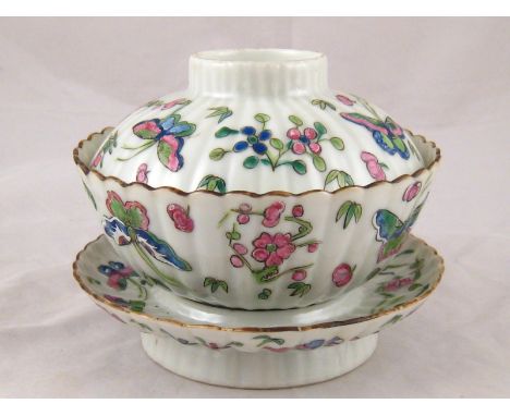 A Chinese ceramic tea bowl, cover and saucer with overglaze enamel butterflies and flowers.
