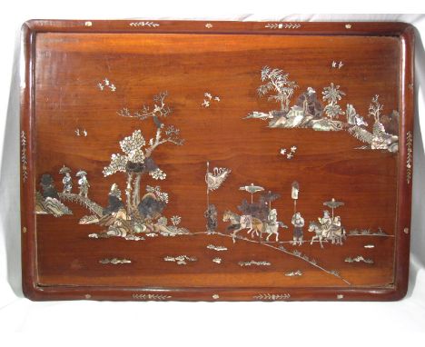 A Chinese hardwood tray or wall plaque inlaid with engraved mother of pearl scenes of Chinese travellers. Losses. 59x42cm. 