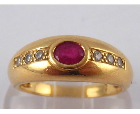 A French hallmarked 18 carat gold ruby and diamond ring, ruby approx 4 x 3mm, size M, 4.1 gms.
