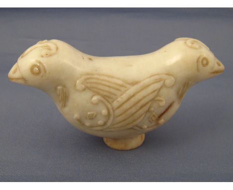 A Chinese white jade cane handle carved as two conjoined birds, approx. 9.5 cm wide, provenance acquired in China in 1920.