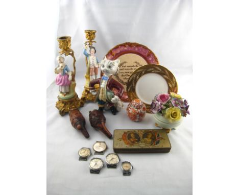 A mixed lot of ceramics, including a pair of figural candlesticks, a Puss in Boots, a bowl of flowers , plates etc. together 
