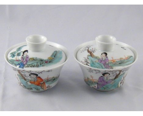 A pair of Chinese ceramic tea bowls and covers. 