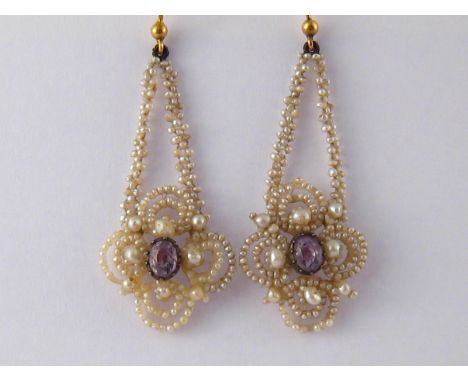 A pair of seed pearl and amethyst earrings, amethysts approx 6 x4 mm, drop approx 5.5cm.