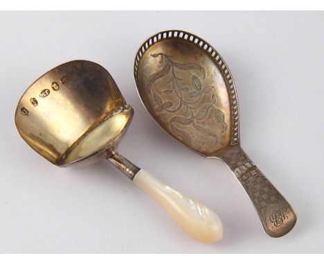 Two Georgian silver caddy spoons by Joseph Wilmore, one with turned m.o.p.handle, Birmingham, 1811, the other an elongated fi