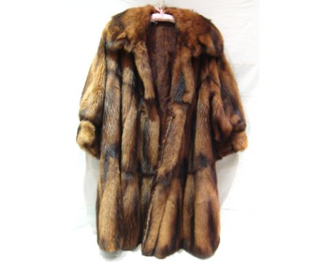 A marten fur coat with vintage lining, 107 cm long x 75 cm across.