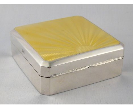 A square Art Deco sterling silver cigarette box with cut corners, the lid with yellow sunburst guilloche enamel by Adie Broth