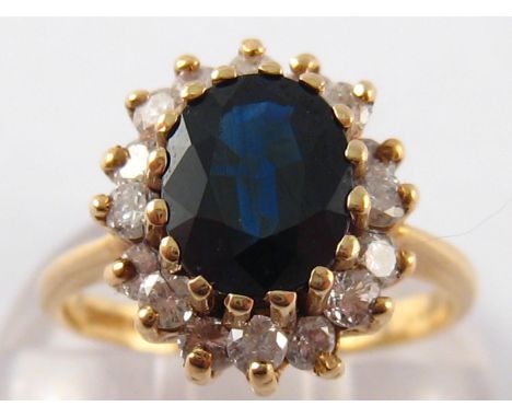 A 9 carat gold sapphire and diamond ring, sapphire approx 8 x 7mm, ring size K, 3.9 gms.
