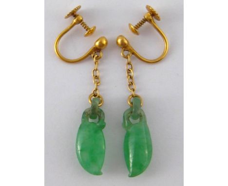 A pair of Chinese carved jade and gold earrings, screw fittings, marked W.H and 20, the jades of good colour each measuring a