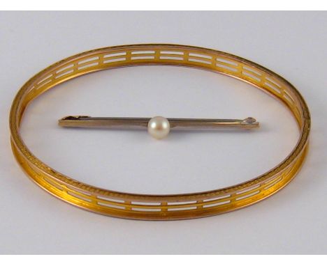 A yellow metal (tests 9 carat gold) bangle, internal diameter approx 7cm, 9.1 gms, together with a white metal (tests 9 carat