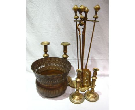 A quantity of brass, comprising two pairs of large candlesticks, 26cm. and 38cm., a set of three fireirons with stand and a p