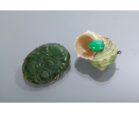 CHINESE JADE BROOCH AND A CHINESE JADE MOUNTED SHELL PENDANT  the brooch of oval form with nine carat gold backing, 4cm wide;