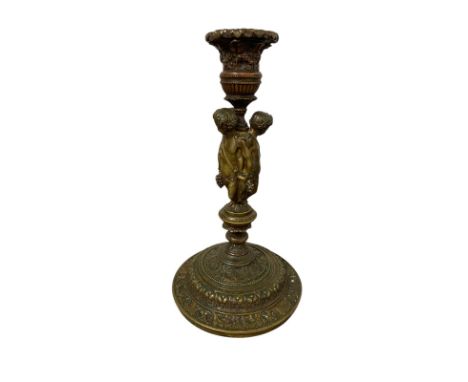 An attractive antique bronze candlestick