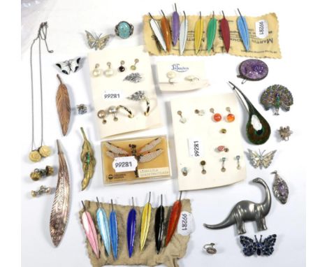 A collection of fifteen sterling silver and enamelled feather brooches, of various colours; a peacock feather brooch; assorte