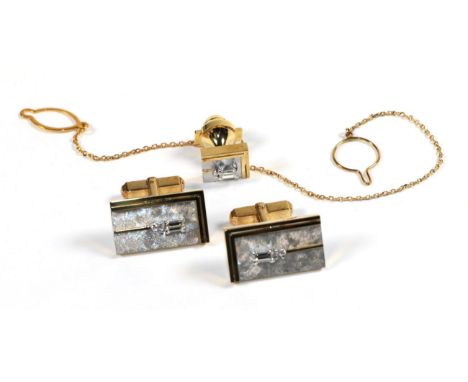 A pair of cuflfinks and matching tie stud, stamped 'K18'.  Gross weight - 22.75 grams. 