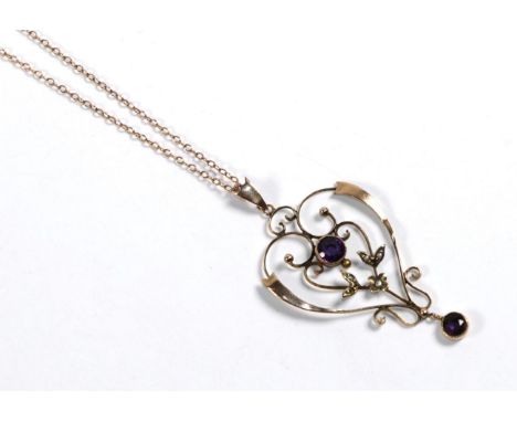 An Edwardian amethyst and seed pearl pendant on chain, pendant length 5cm, chain length 42cm .  One seed pearl missing. Penda