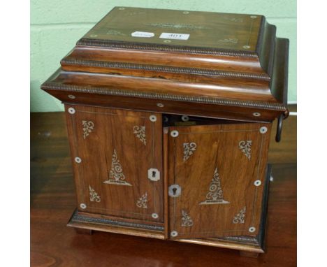 A 19th century mother of pearl inlaid rosewood table top jewellery cabinet with caddy top and ring handles